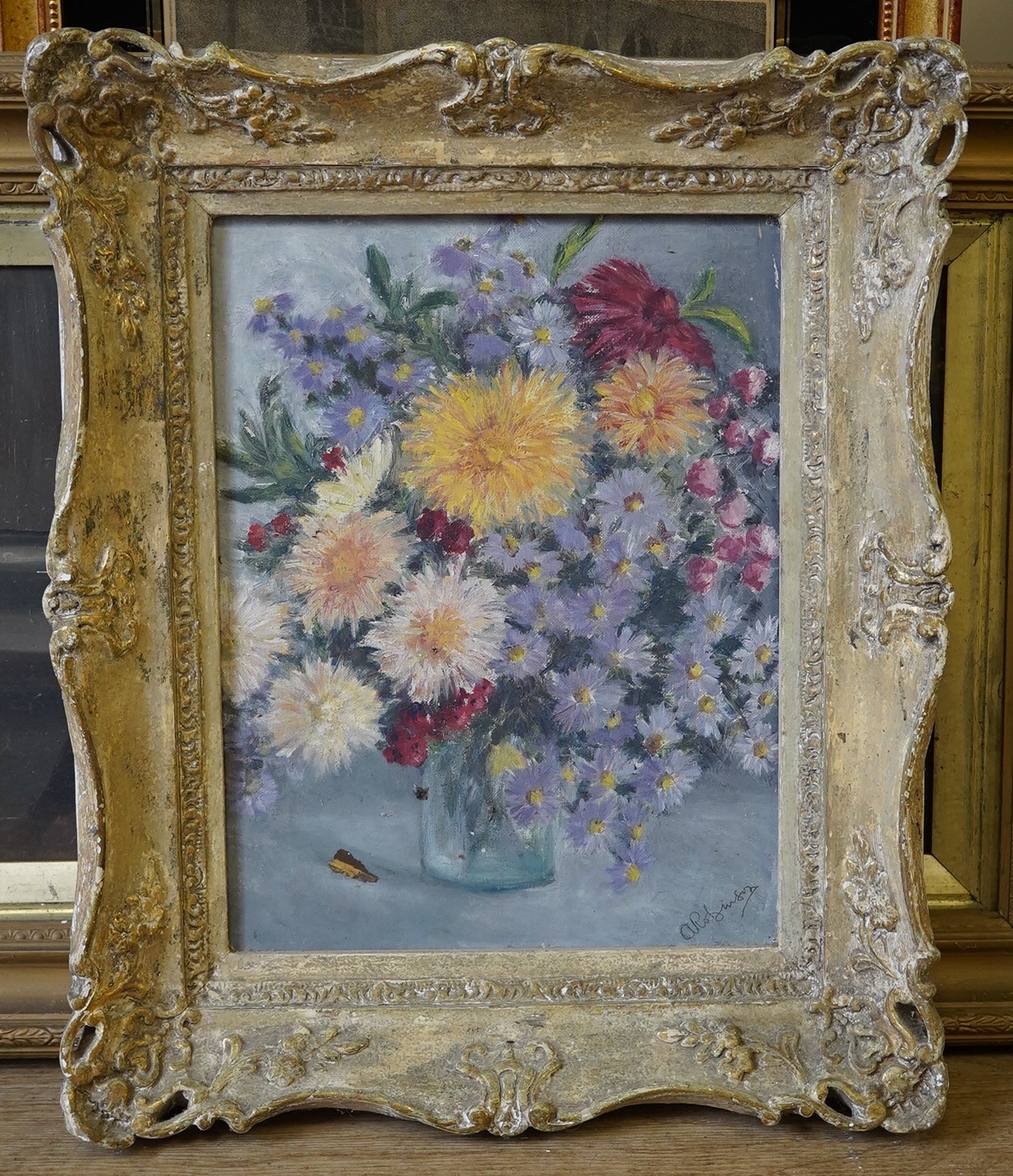 A. Robinson, oil on canvas, Still life of flowers in a glass vase, signed, 34 x 26cm, ornately framed. Condition - fair to good